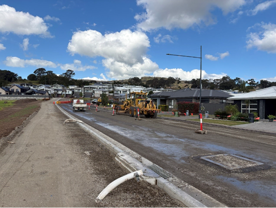 Asphalting works in progress on Yellow Rock Road as part of the road pavement and intersection upgrade project.